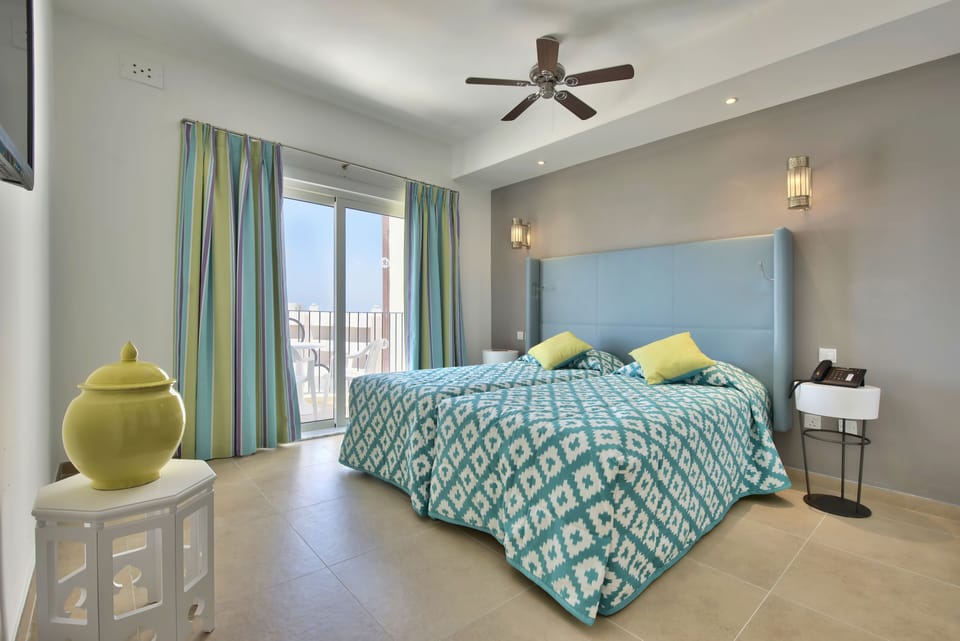 Memory foam beds, minibar, in-room safe, blackout drapes