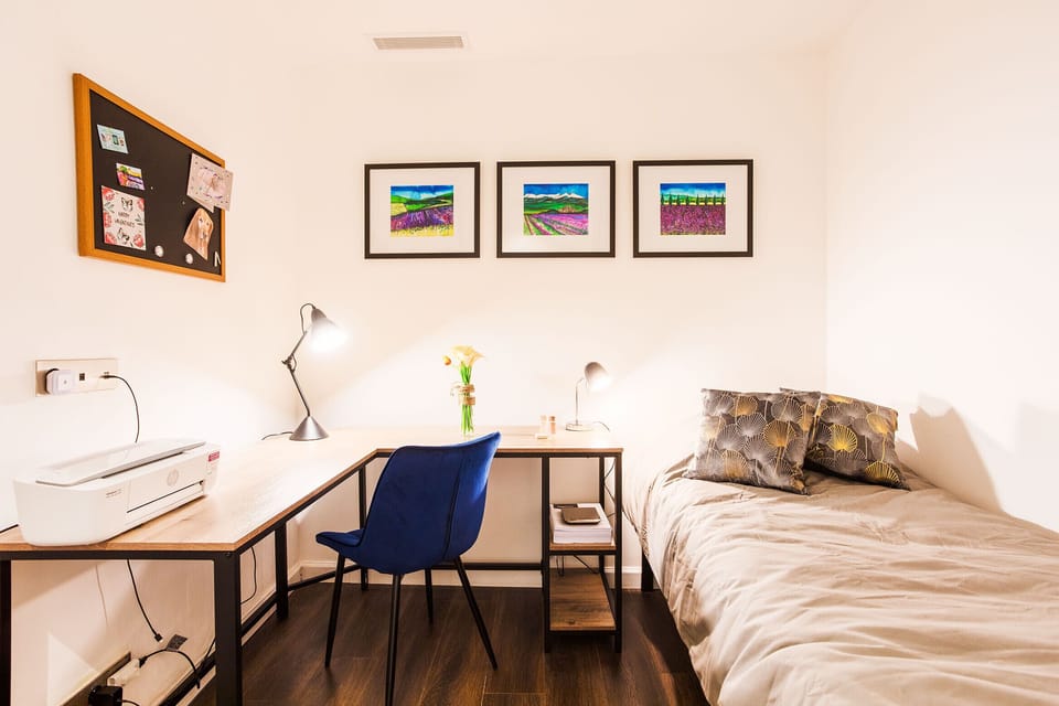 bedroom with single bed and desk
