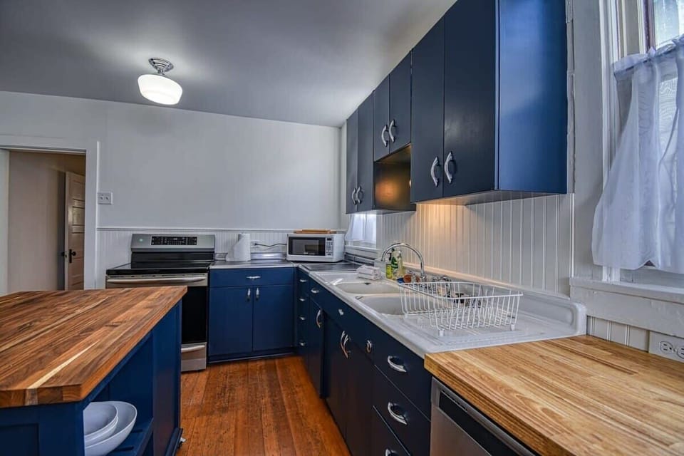 【Kitchen — Prep】 Stainless range, dishwasher, deep farmhouse sink — stocked for multi-night group stays.