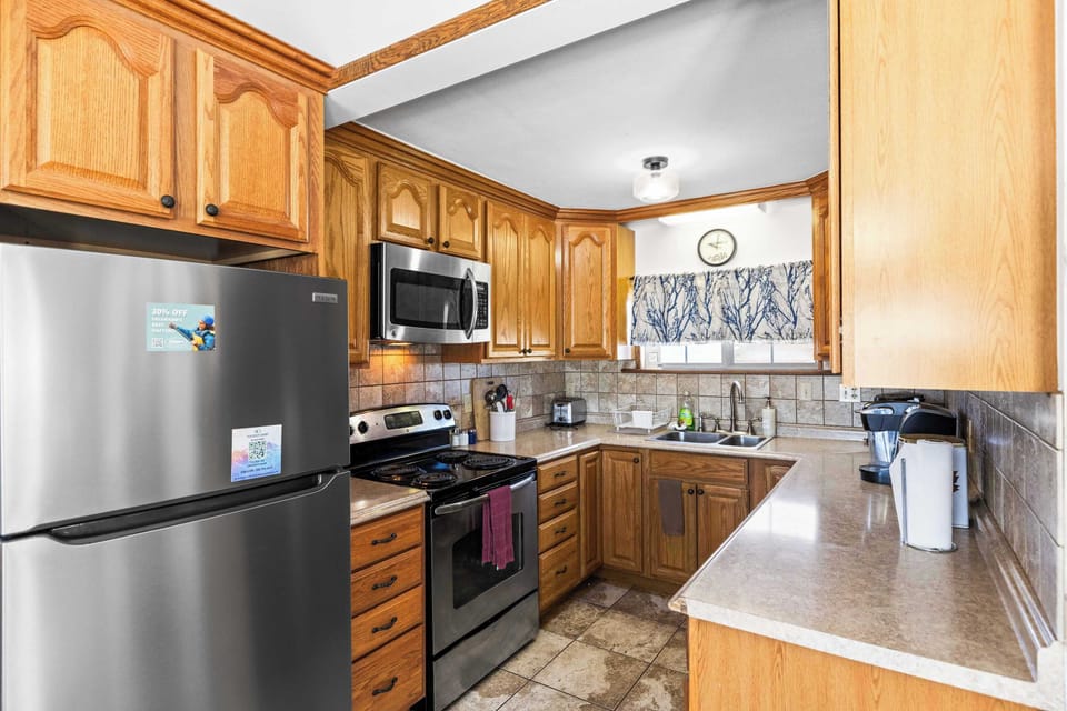 【Kitchen】 Full-size range, dishwasher, coffee maker — stocked for a week of home-cooked meals.
