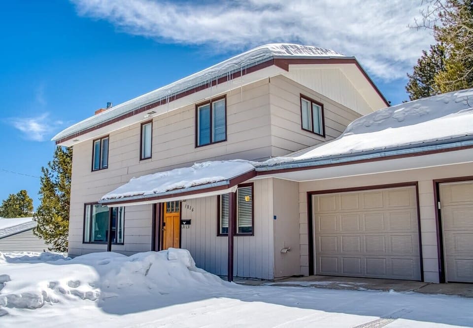 【Exterior】The Shamrock from the driveway — wooded lot, 2-car garage, southern exposure.