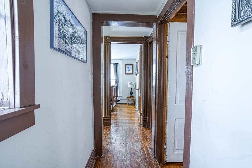 【Hallway】 Main-floor hall linking bedrooms, kitchen, and the living space.