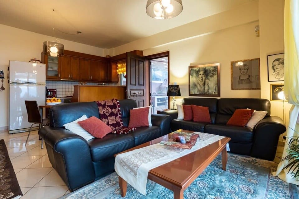 Relax in the inviting living room area, where comfort meets style - Inviting living room area, where comfort meets style