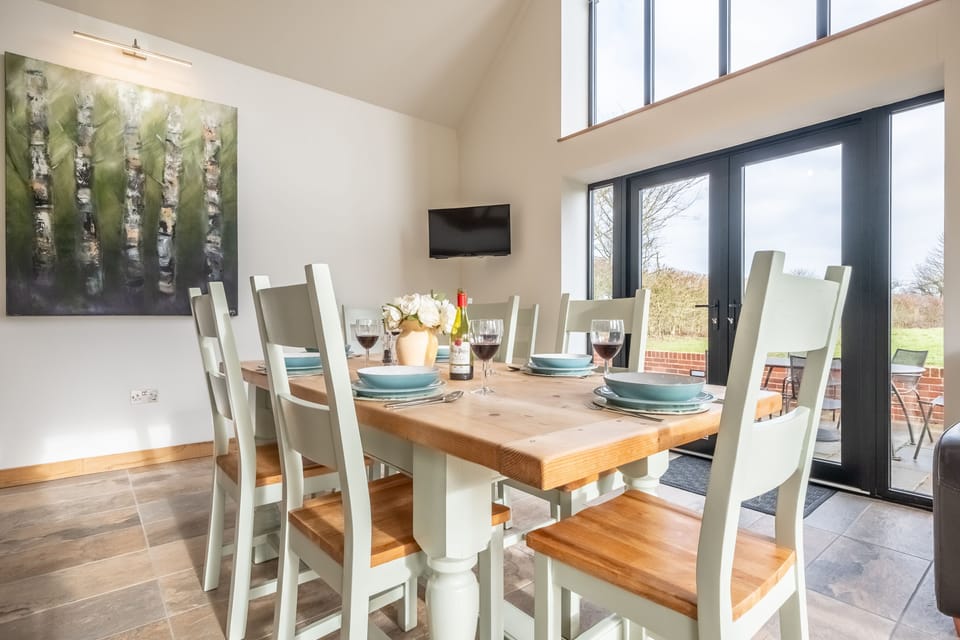 Ground floor: Dining area beside the patio doors