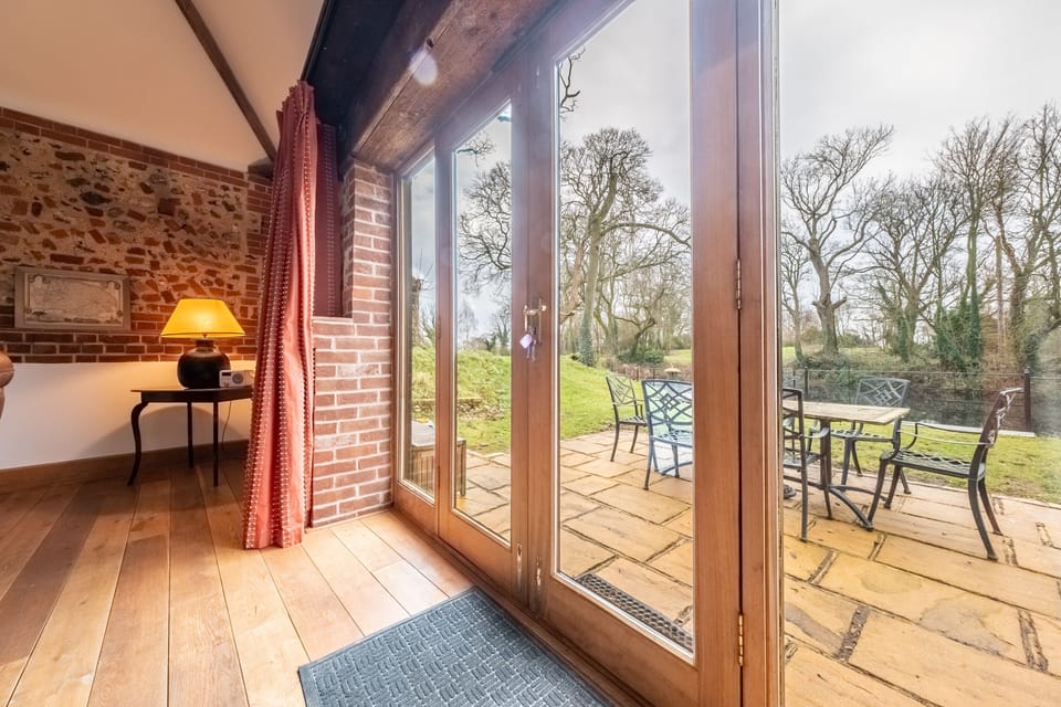 Ground floor: French doors open to a side patio