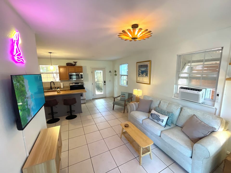 A bright and spacious main living space with the funky charm of Gulfport.