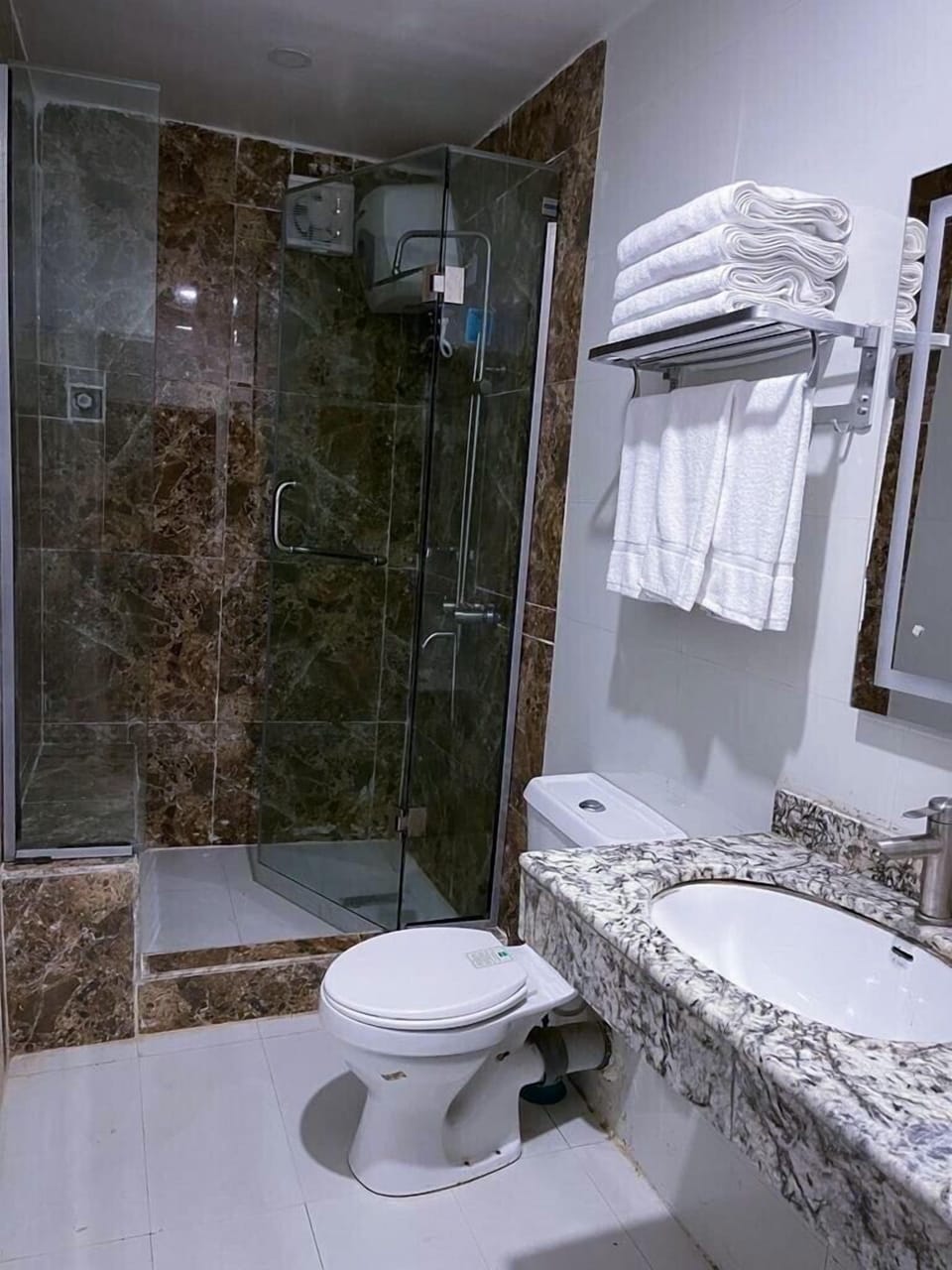 Shower, rainfall showerhead, hair dryer, towels