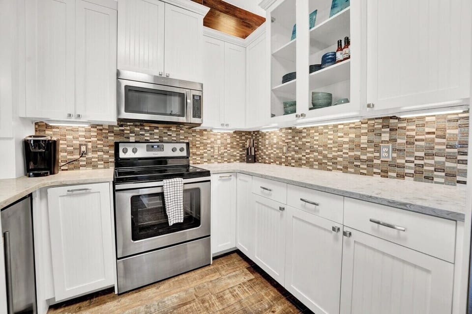 The kitchen features stainless steel appliances that make cooking easy and enjoyable during your stay.