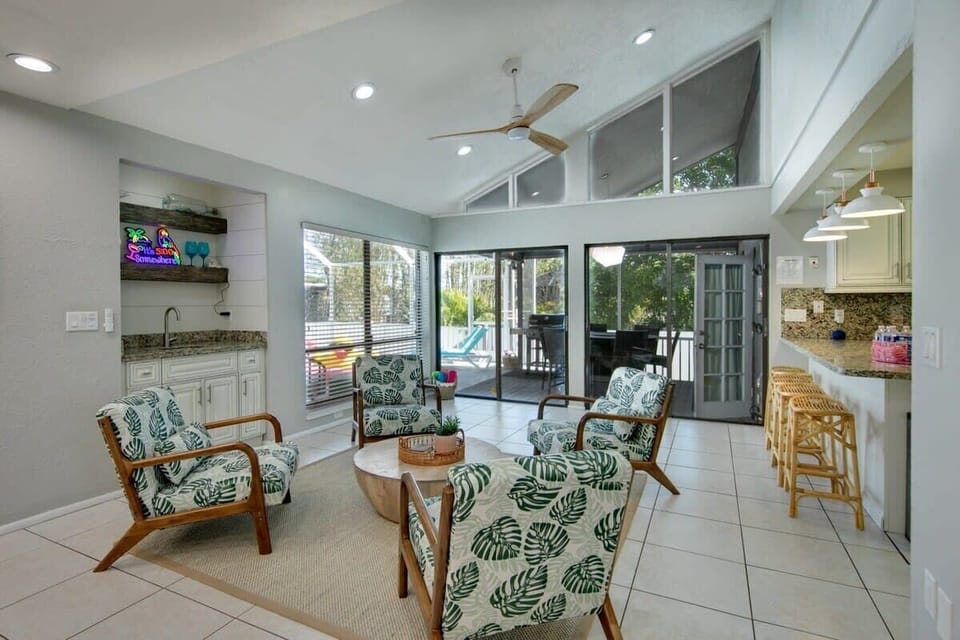 Enjoy your morning coffee around the sitting area between the kitchen and the pool!