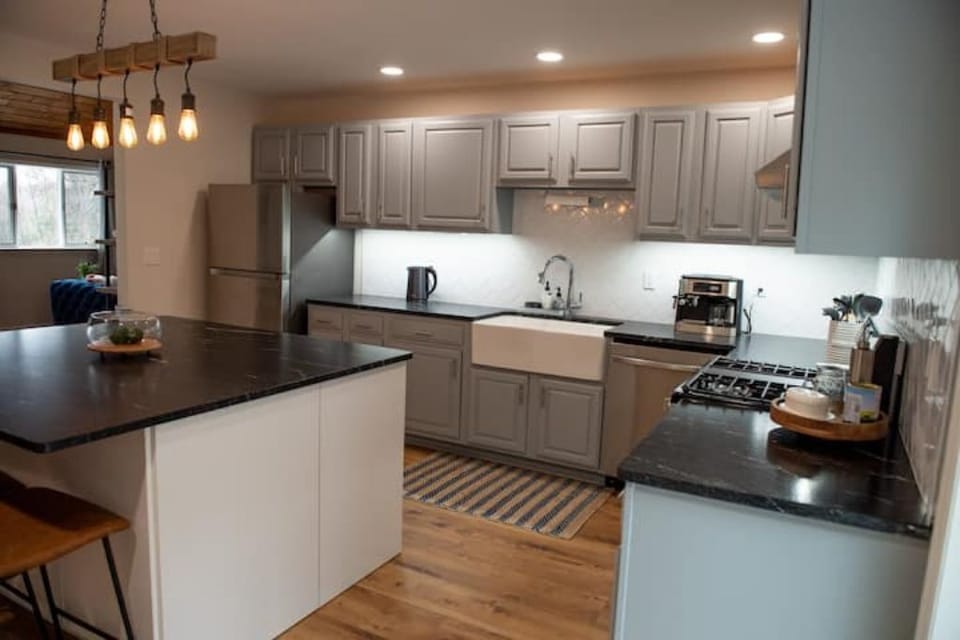 A different view of the kitchen, with the living room off to the far left.