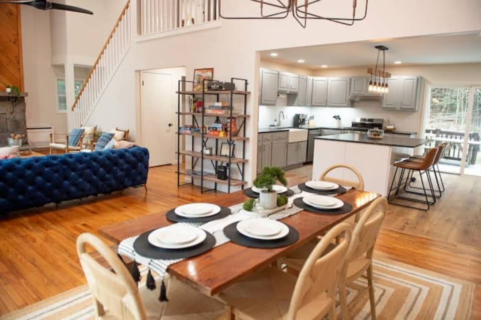 A view of the dining room into the living room (left) and kitchen (right)