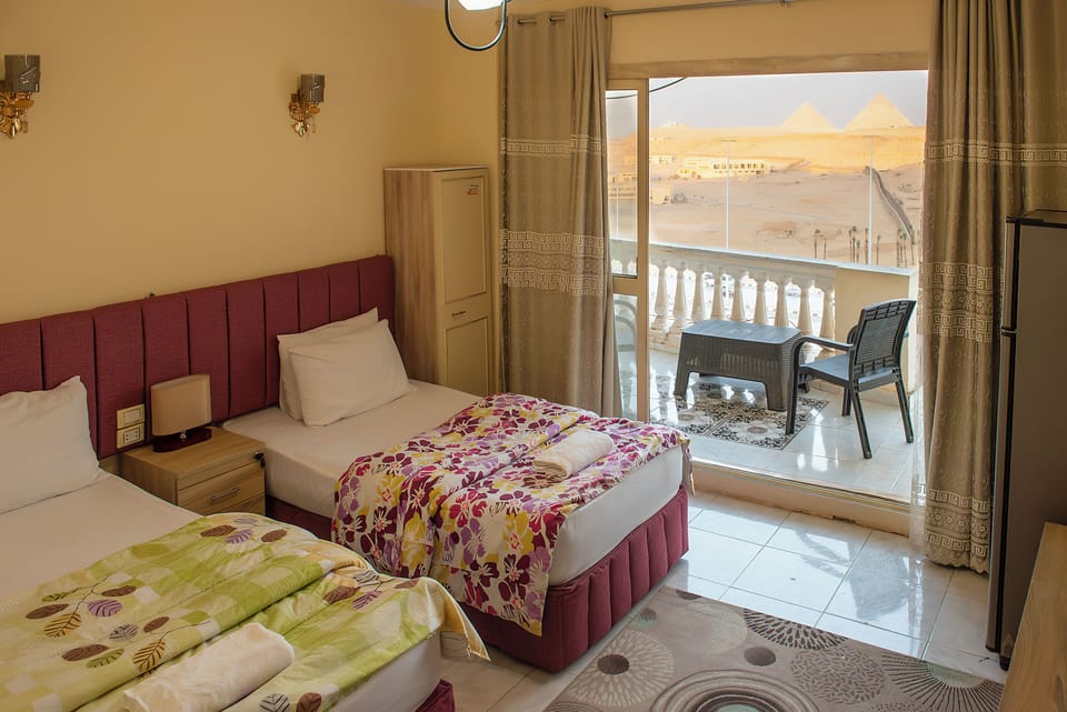 Twin Room, Pyramid view with Balcony | Hypo-allergenic bedding, individually decorated, desk, laptop workspace