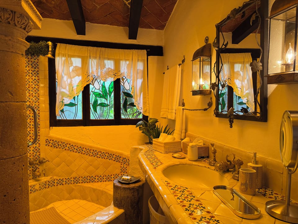 Premium Room | Bathroom | Rainfall showerhead, hair dryer, slippers, towels