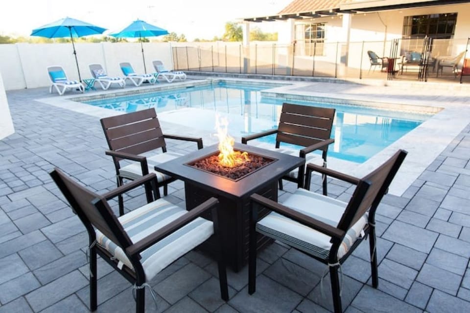 Propane fire table beside our large, heated Pool. 