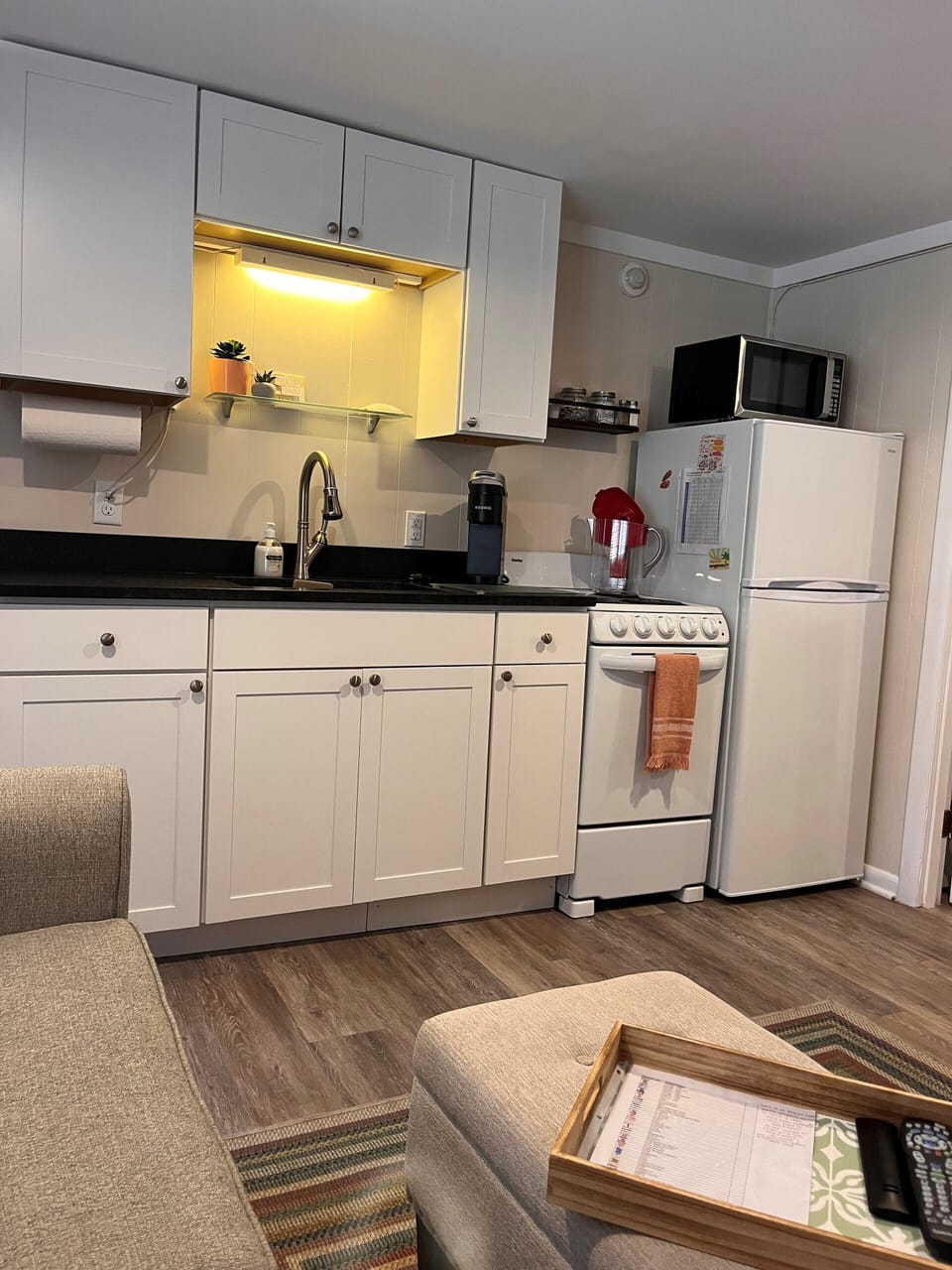 Fully stocked kitchen with dinnerware, utensils, microwave.  Just add food.