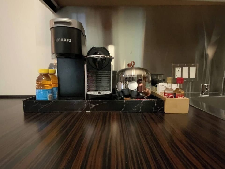 Complimentary Keurig Coffee and Espresso Station with coffee pus expresso pods.