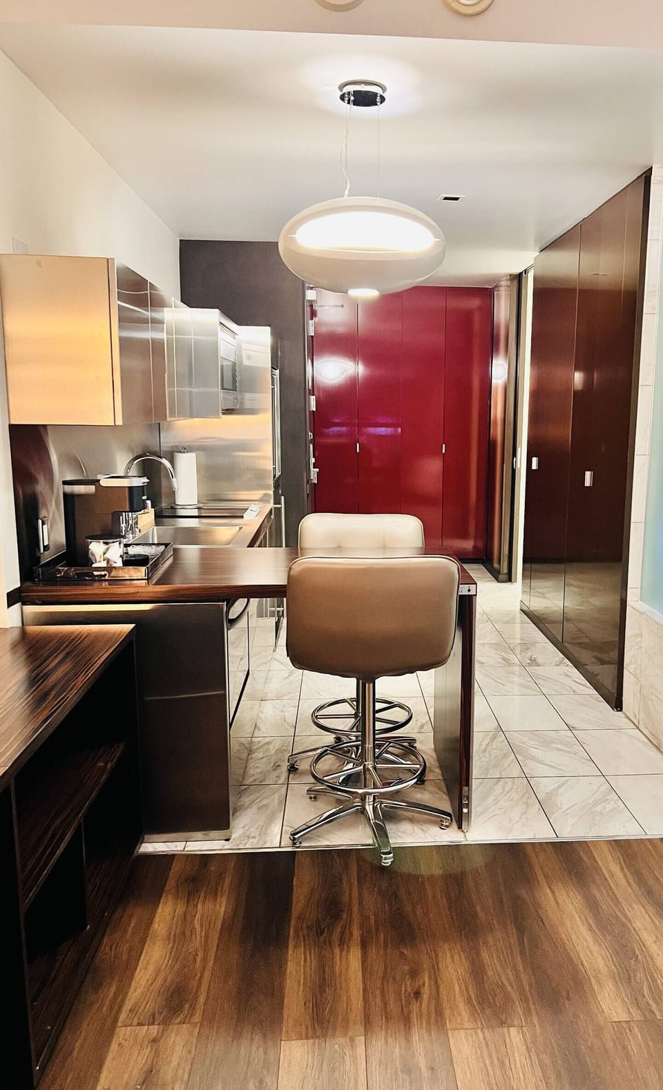 Dining Area & Kitchenette with stainless steel appliances.  Stove, Mini fridge and dishwasher.