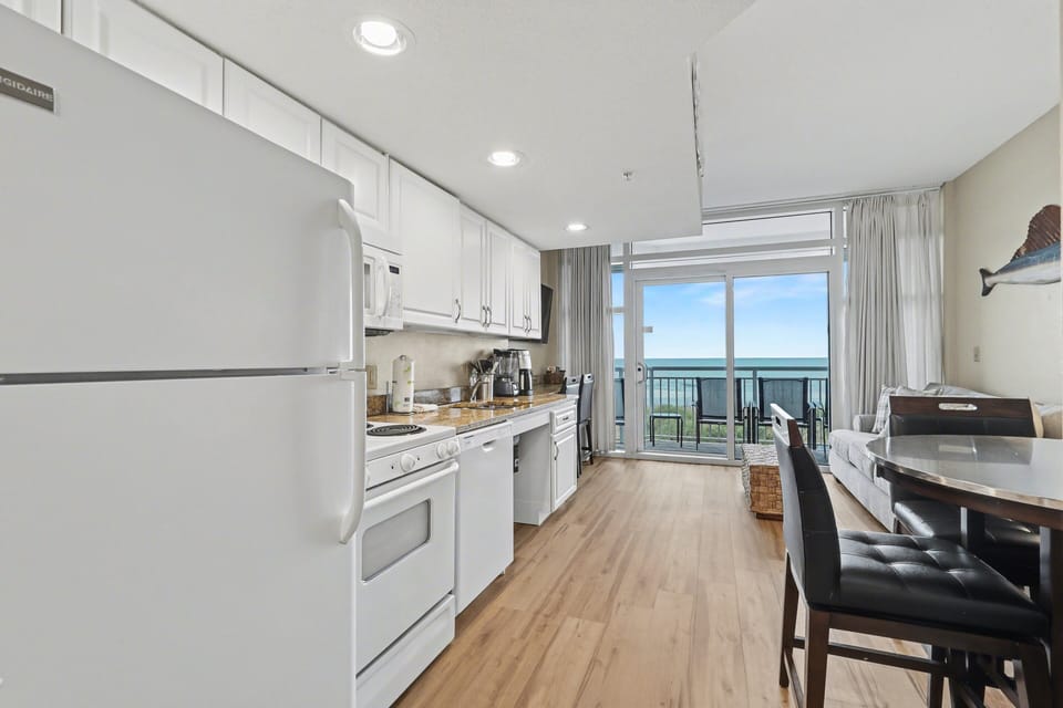Kitchen: Sleek design with ocean views, ideal for creating memorable meals with a view!