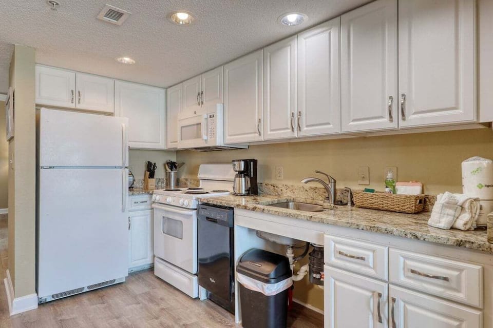 Updated kitchen with full size stove, fridge and dishwasher