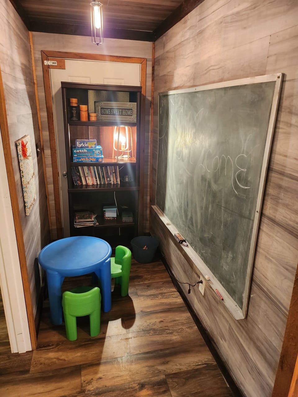 Kids Play Area.  Chalkboard | Table & Chairs | Games| Coloring Books | Crayons