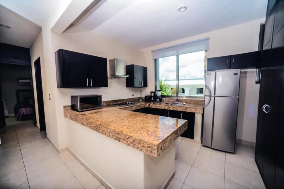 Luxury Apartment, 2 Bedrooms | Private kitchen | Full-size fridge, microwave, stovetop, coffee/tea maker