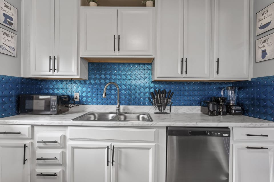 Embark on a culinary journey in our well-equipped kitchen, stocked with utensils and kitchenware for feasting and fun.