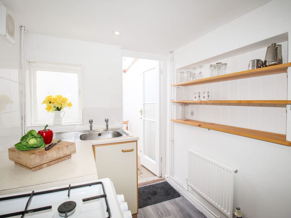Fridge, electric kettle, toaster, cookware/dishes/utensils