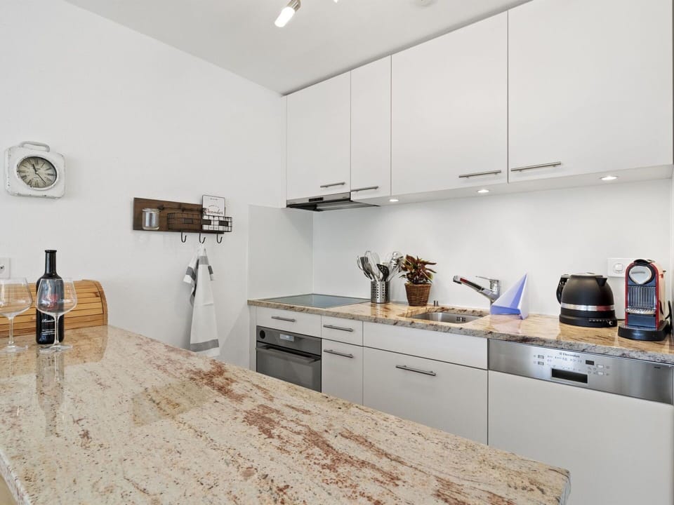 Cabinetry, Countertop, Property, Sink, Tap, Bottle, Kitchen Stove, Wood, Drawer, Flooring