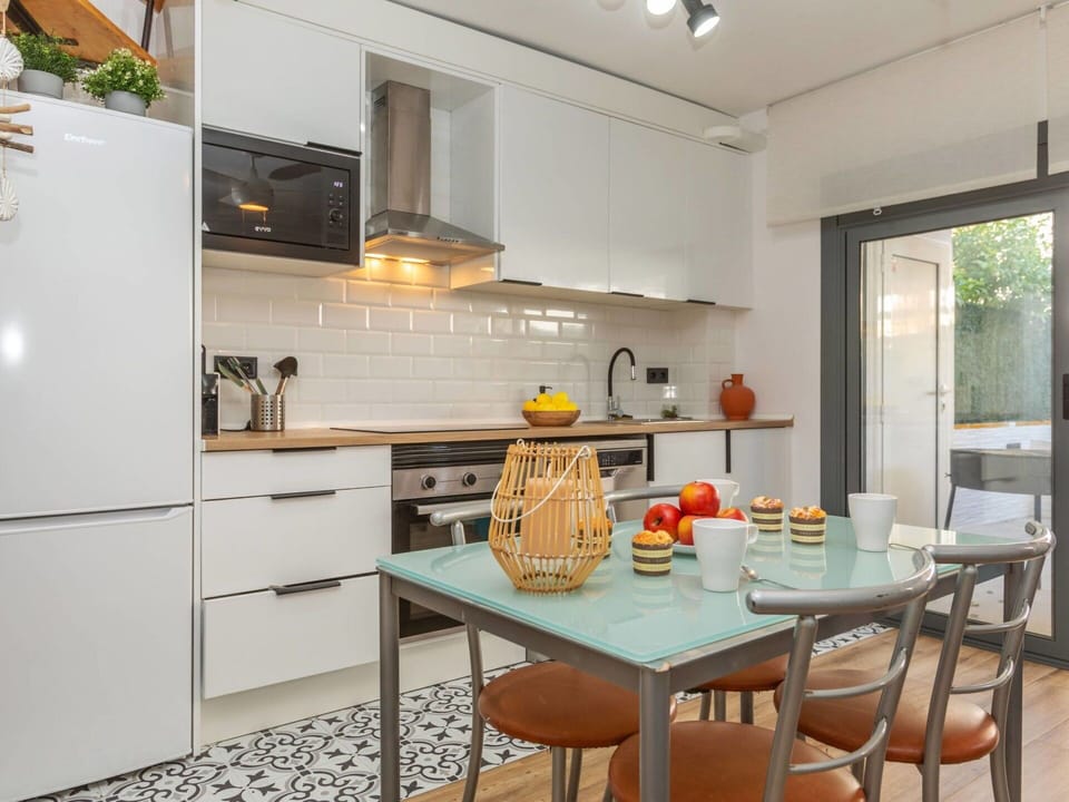 Furniture, Kitchen Appliance, Kitchen, Countertop, Cabinetry, Interior Design, Major Appliance, Flooring, Home Appliance, Kitchen Stove