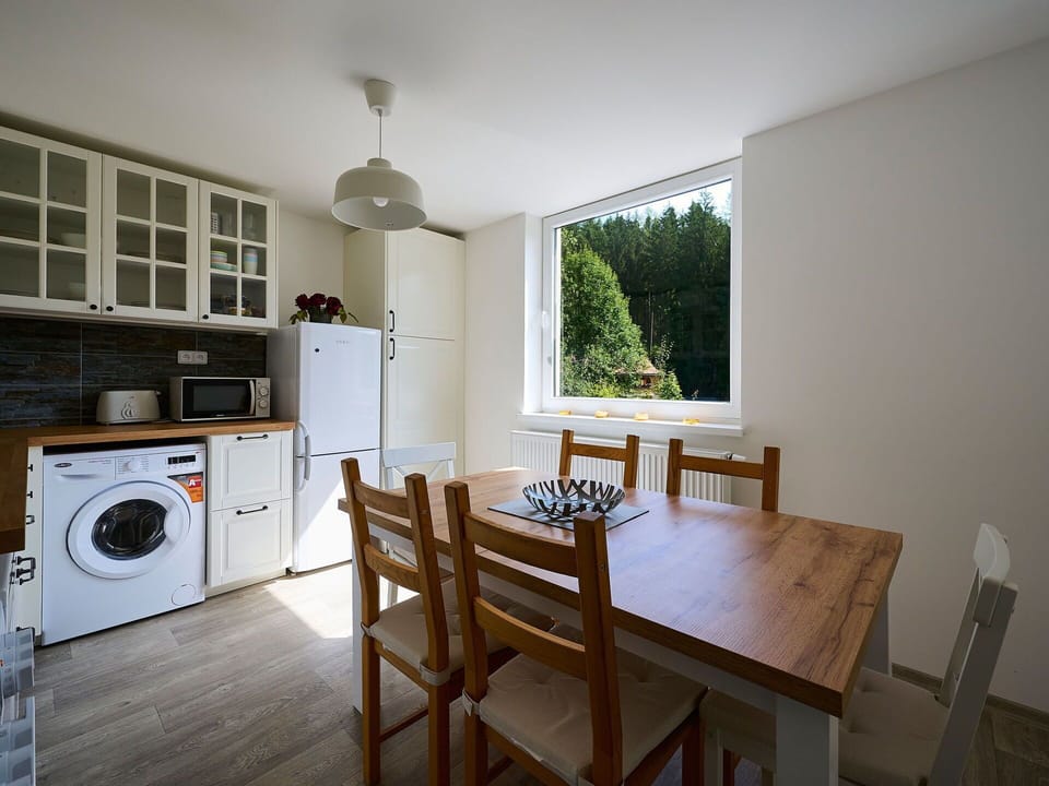 Furniture, Property, Table, Cabinetry, Chair, Wood, Kitchen Stove, Countertop, Interior Design, Window