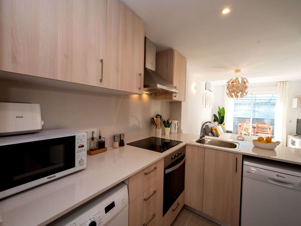 Cabinetry, Countertop, Kitchen Appliance, Kitchen, Drawer, Wood, Sink, Interior Design, Kitchen Stove, Flooring