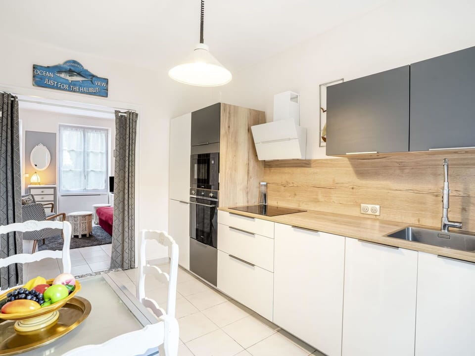 Kitchen Appliance, Kitchen, Countertop, Furniture, Cabinetry, Interior Design, Major Appliance, Flooring, Wood, Floor