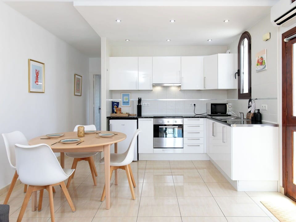 Furniture, Interior Design, Kitchen, Flooring, Countertop, Floor, Kitchen Appliance, Major Appliance, Wood, Cabinetry