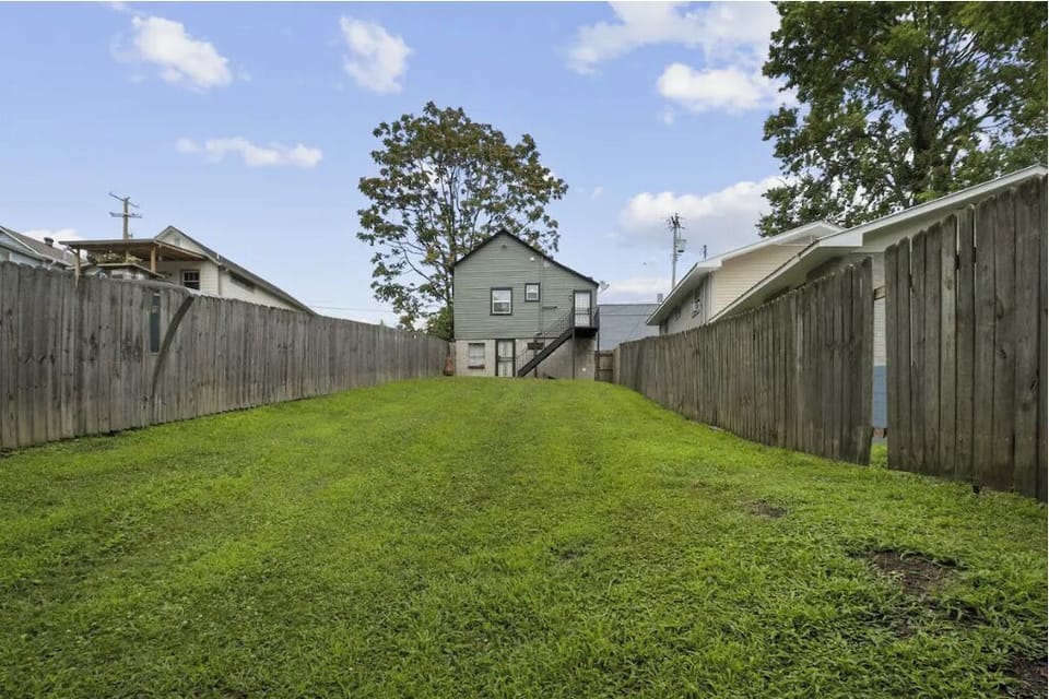 Large fenced-in backyard, great for lounging or pets!
