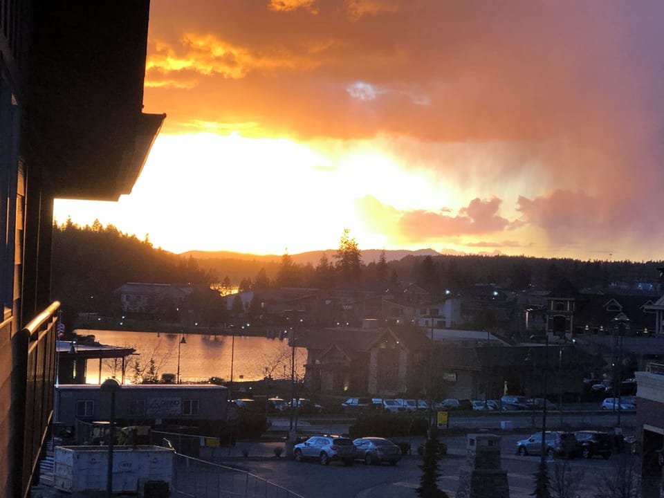View of the summer sunsets & Riverstone Lake from the private balcony.
