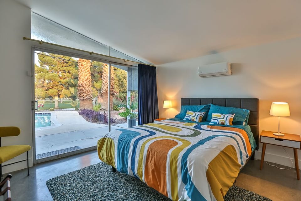 Bedroom #3 with queen bed, pool access and golf course views.