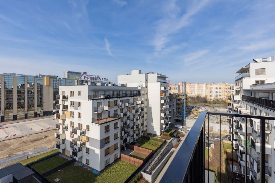 Another angle of the modern apartment complex, showcasing its clean lines and urban layout.
