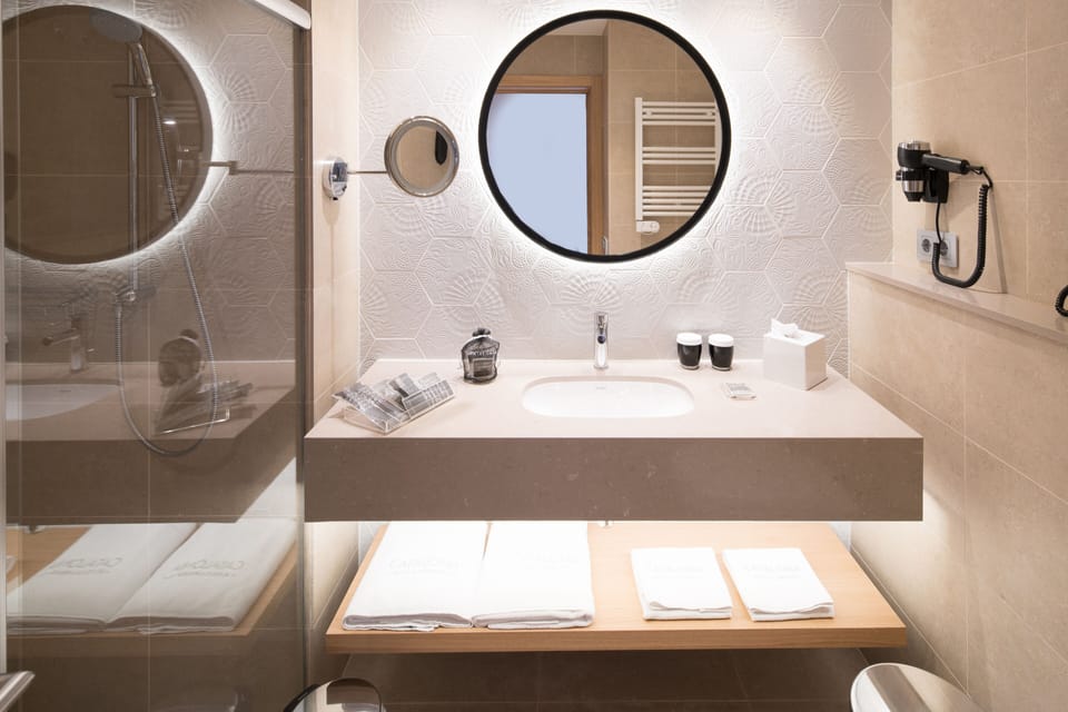 Eco-friendly toiletries, hair dryer, towels