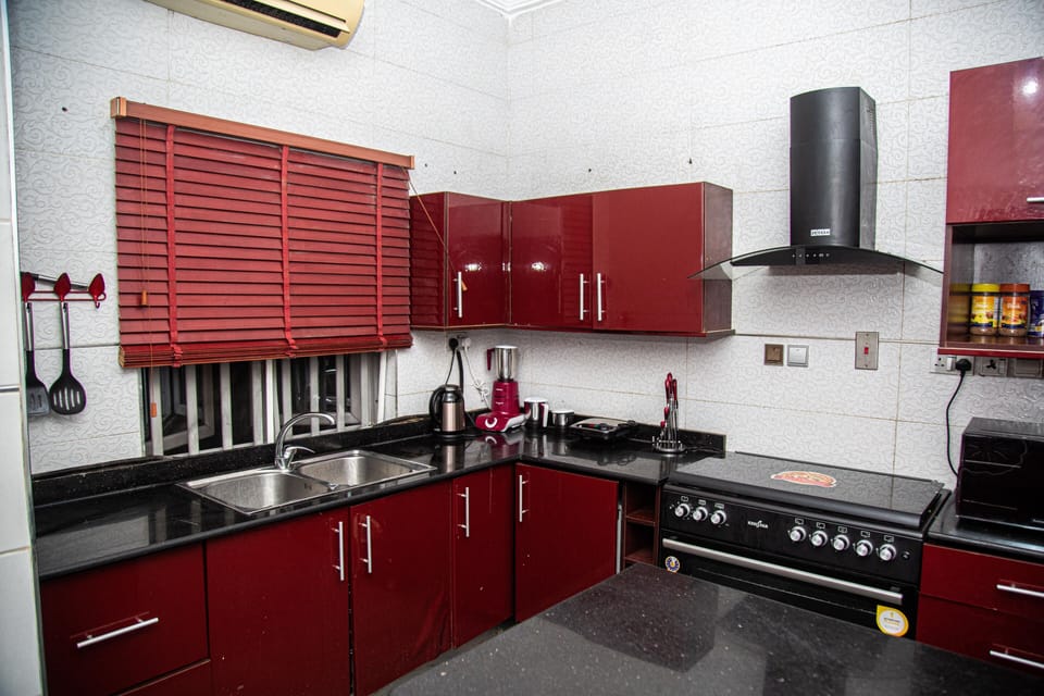 Luxury Apartment | Private kitchen | Full-size fridge, microwave, oven, toaster