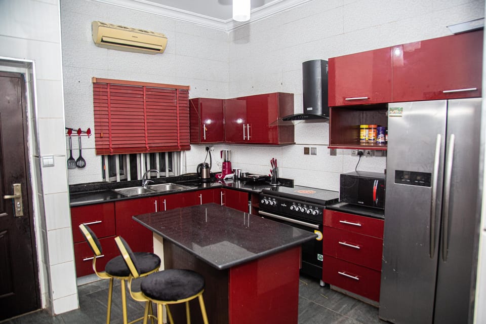 Luxury Apartment | Private kitchen | Full-size fridge, microwave, oven, toaster