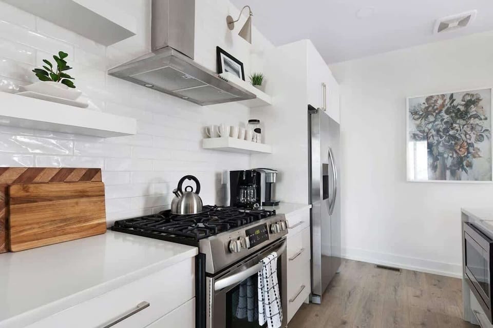 Fully Stocked Kitchen with Modern Appliances and Ample Storage
