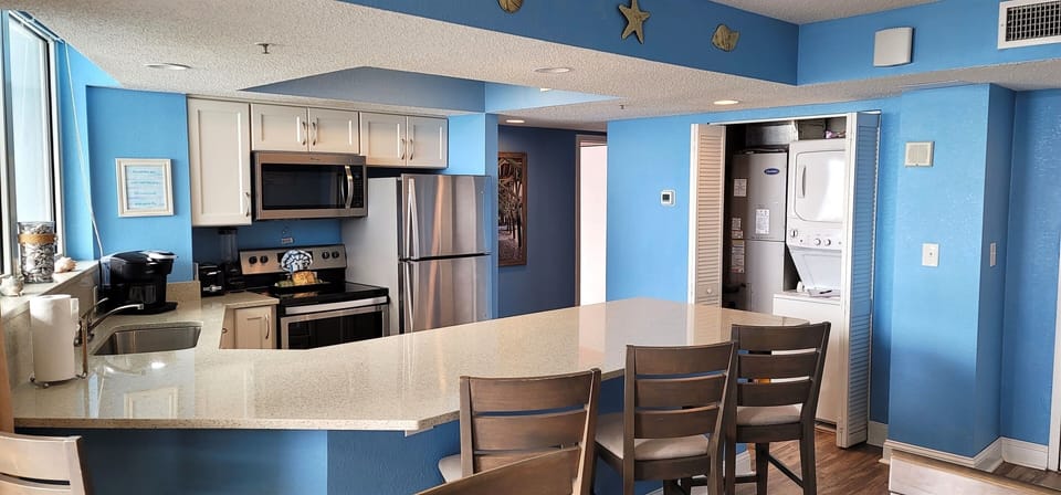 Kitchen Area with Washer Dryer Utility Room