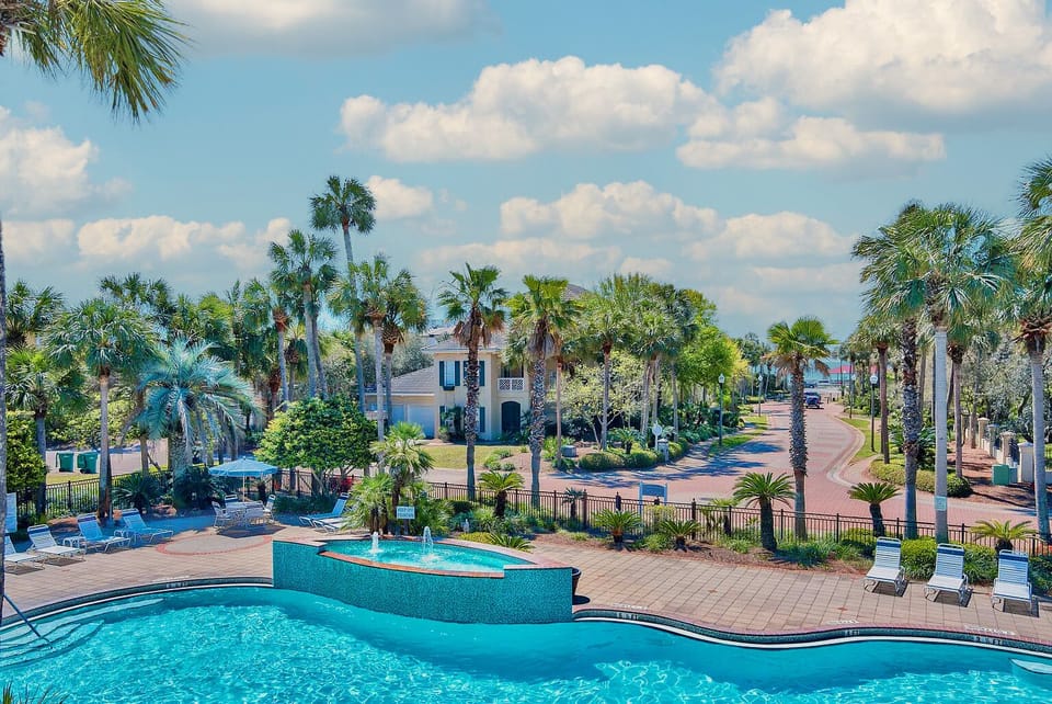 Lush gardening and resort pool with some the Gulf's view