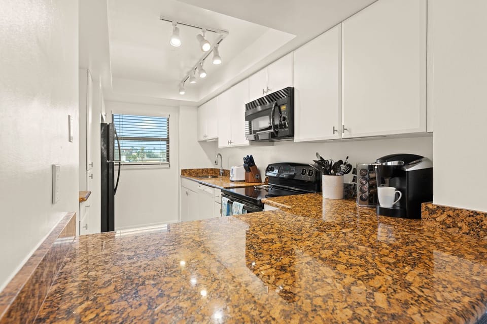 Modern kitchen with Keurig, perfect for your morning coffee.