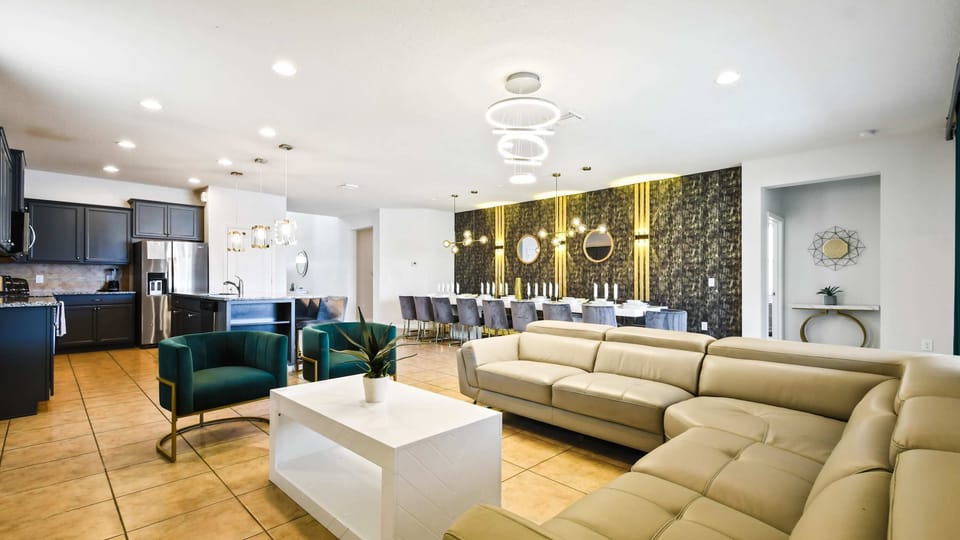 Elegant open living with gourmet kitchen, luxe dining, and plush modern seating.