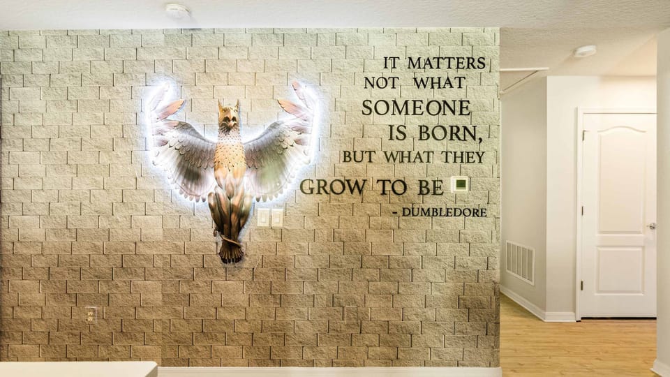 Magical Harry Potter-themed decor with Dumbledore quote and illuminated phoenix.