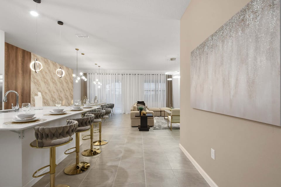 Sophisticated open-concept retreat with designer lighting and plush seating
