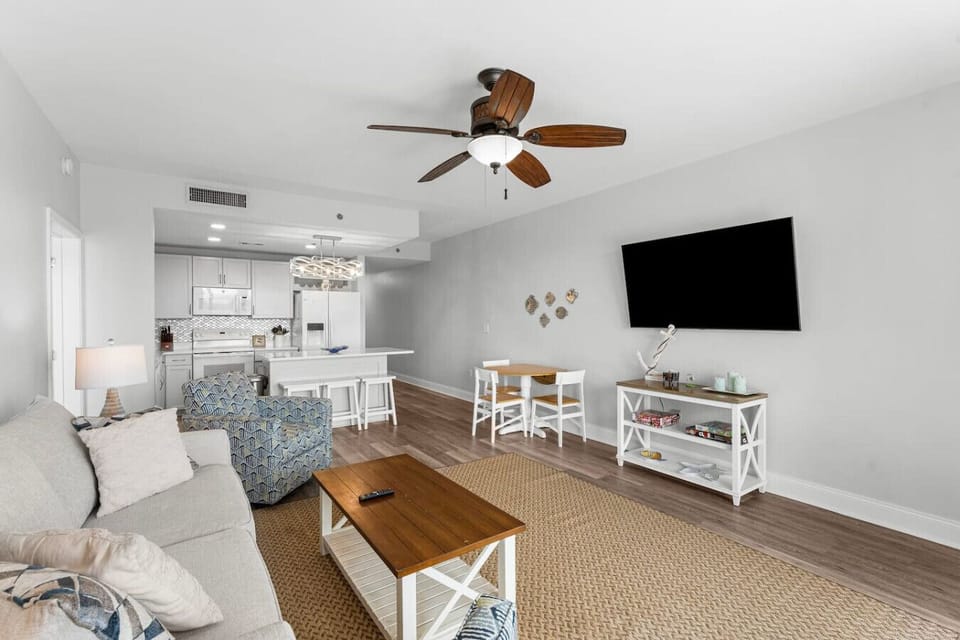 Open Concept Living Room with Sleeper Sofa, Flat Screen TV, Lake Views and Direct Balcony Access