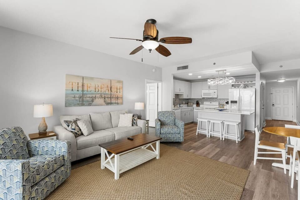 Open Concept Living Room with Sleeper Sofa, Flat Screen TV, Lake Views and Direct Balcony Access