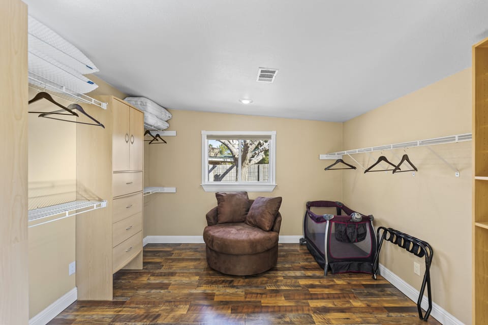 Master closet also has pack & play / blackout window covering